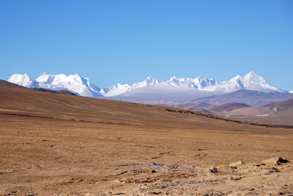 41 Lachama Chuli And Other 6500m Mountains On Border Between Tibet And Nepal From Road Between Paryang Tibet And Mount Kailash Lachama Chuli (6721m), the broad mountain on the left, sits on the Nepal Tibet border with other 6500m mountains to the right, seen on the road between Paryang Tibet and Mount Kailash.